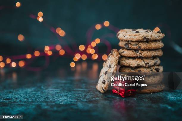 christmas cookies over wood background. homemade cookies - brown table stock pictures, royalty-free photos & images