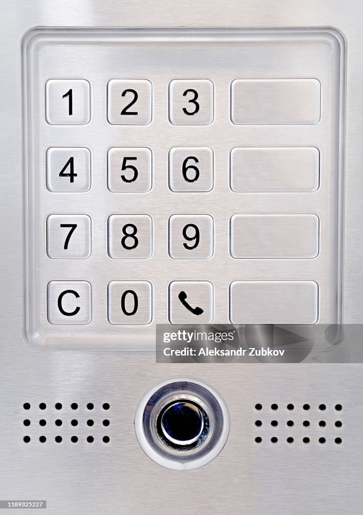 Dial intercom or door with combination lock.