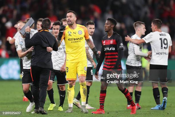 Wanderers goalkeeping coach Davide Del Giovine is held back by Scott Jamieson of Melbourne City FC after having words with Melbourne City FC...