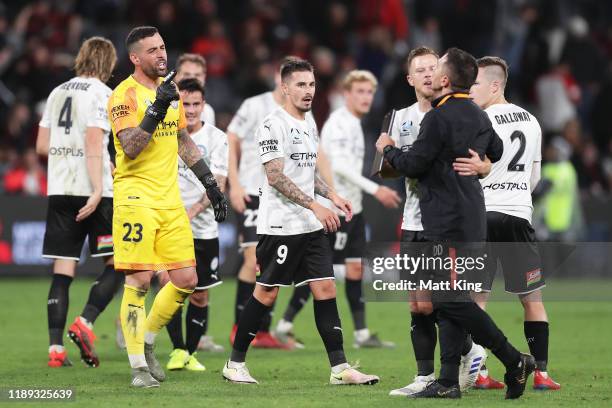 Wanderers goalkeeping coach Davide Del Giovine is held back by Scott Jamieson of Melbourne City FC after having words with Melbourne City FC...