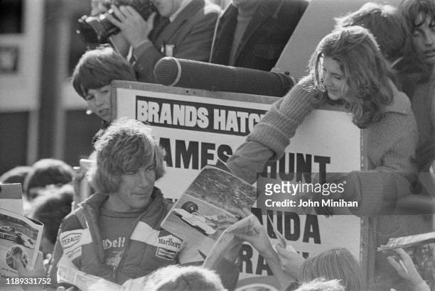 British racing driver James Hunt signing autographs to fans at Brands Hatch, UK, 7th November 1976.
