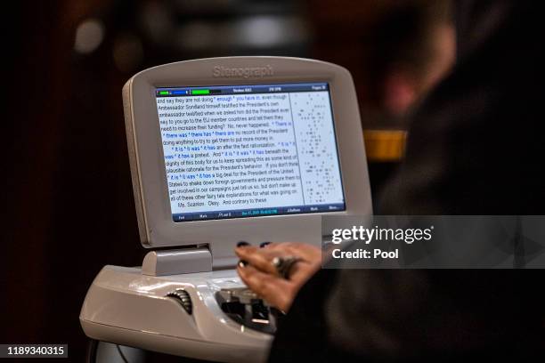 Court stenographer records testimony during a House Rules Committee hearing on the impeachment against President Donald Trump on December 17, 2019 in...