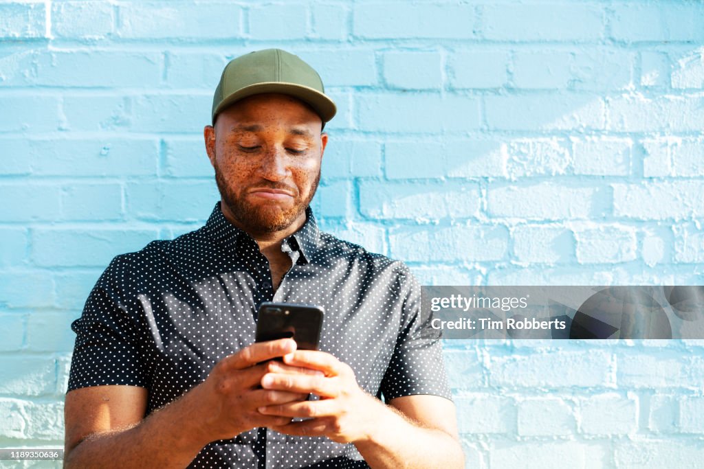 Man reacting to smart phone