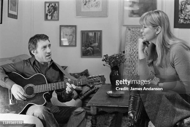 French actress Marina Vlady is serenaded by her husband Vladimir Vysotsky, a Russian anti-establishment actor, poet, songwriter and singer, at their...