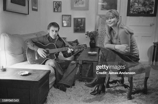 French actress Marina Vlady is serenaded by her husband Vladimir Vysotsky, a Russian anti-establishment actor, poet, songwriter and singer, at their...