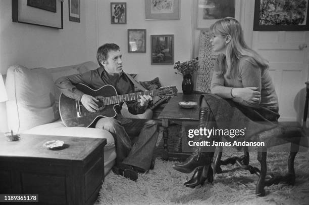 French actress Marina Vlady is serenaded by her husband Vladimir Vysotsky, a Russian anti-establishment actor, poet, songwriter and singer, at their...