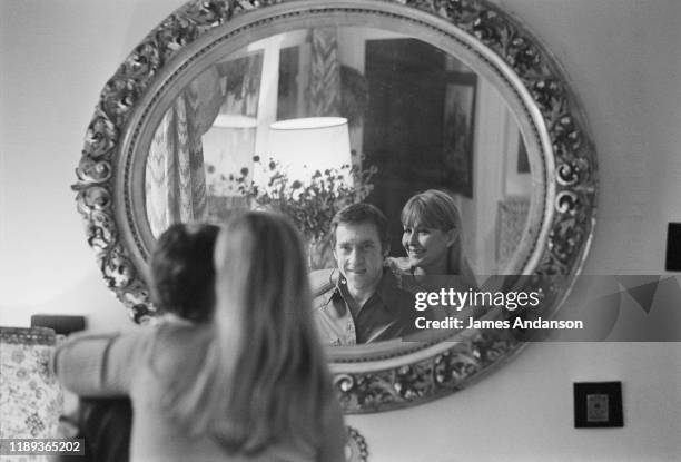 French actress Marina Vlady looking into a mirror at the home she shares with her husband Vladimir Vysotsky, a Russian anti-establishment actor,...