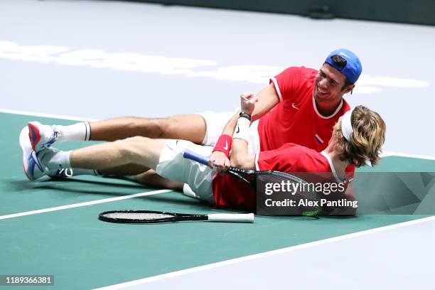 Andrey Rublev of Russia and team mate Karen Khachanov celebrate winning match point in their quarter final doubles match against Serbia on Day Five...