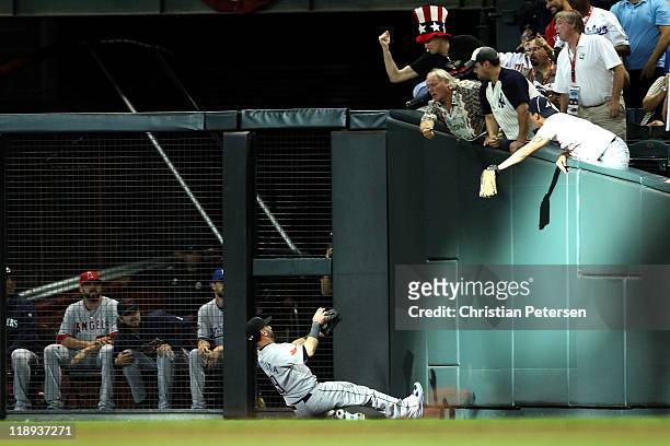 American League All-Star Jose Bautista of the Toronto Blue Jays makes a sliding catch in right field in the second inning of the 82nd MLB All-Star...