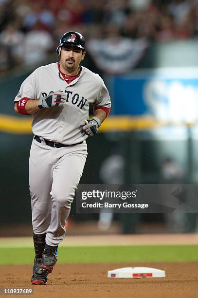 American League All-Star Adrian Gonzalez of the Boston Red Sox rounds the bases after hitting a solo home run in the top of the fourth inning of the...