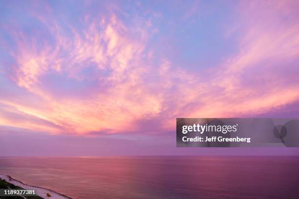 Miami Beach, sunset altostratus clouds over Atlantic oceana.
