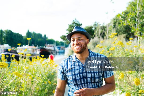 happy man outside - man flower shirt fotografías e imágenes de stock