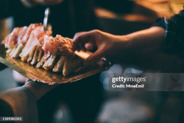 eating grilled cheese sandwich during a party - ham imagens e fotografias de stock