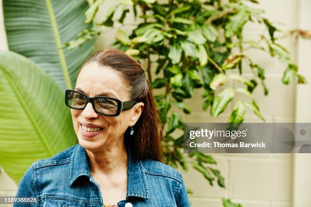 Portrait of smiling senior woman wearing sunglasses