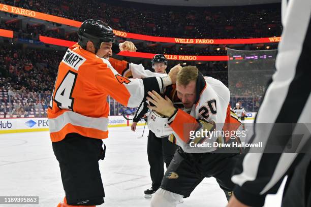Chris Stewart of the Philadelphia Flyers and Nicolas Deslauriers of the Anaheim Ducks fight in the first period at Wells Fargo Center on December 17,...