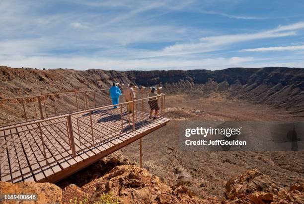 tourists viewing the arizona meteor crater - northern arizona v arizona stock pictures, royalty-free photos & images