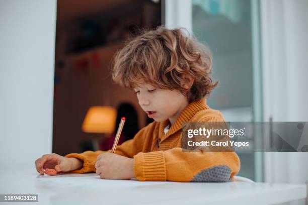 boy doing some homeworks - 7 years old drawing stock pictures, royalty-free photos & images