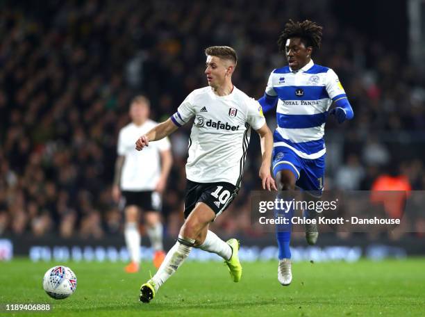 Tom Cairney of Fulham FC and Eberechi Eze of Queens Park Rangers in action during the Sky Bet Championship match between Fulham and Queens Park...