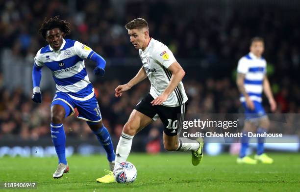 Tom Cairney of Fulham FC and Eberechi Eze of Queens Park Rangers in action during the Sky Bet Championship match between Fulham and Queens Park...