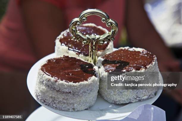 russian hats dessert, mini cakes - ruske kape - coconut biscuits stockfoto's en -beelden