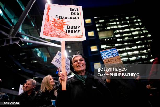 Patricia Crosby of San Francisco participates in a demonstration in part of a national impeachment rally, at the Federal Building in San Francisco,...