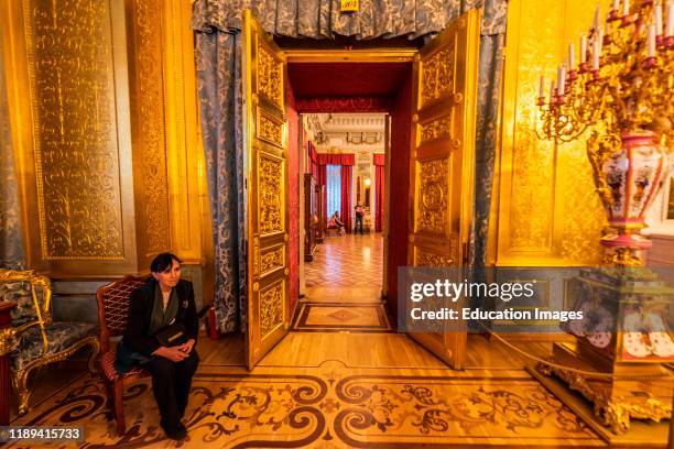 Old custodian in the Winter Palace in the State Hermitage Museum in St Petersburg, Russia.