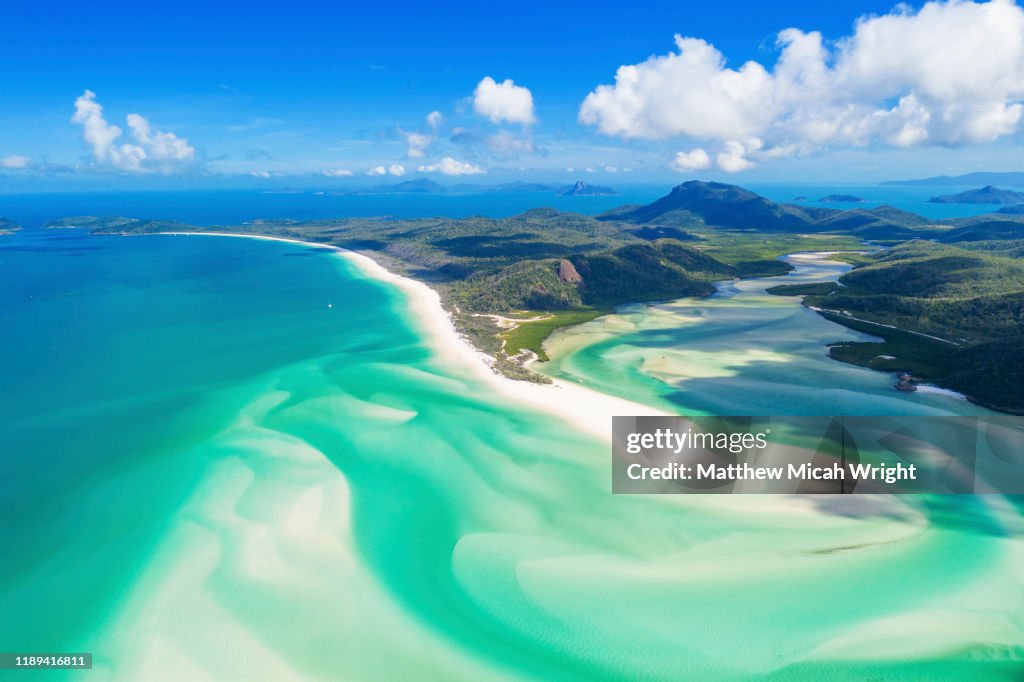 The white silica sand of Whitehaven Beach is a popular tourist draw.