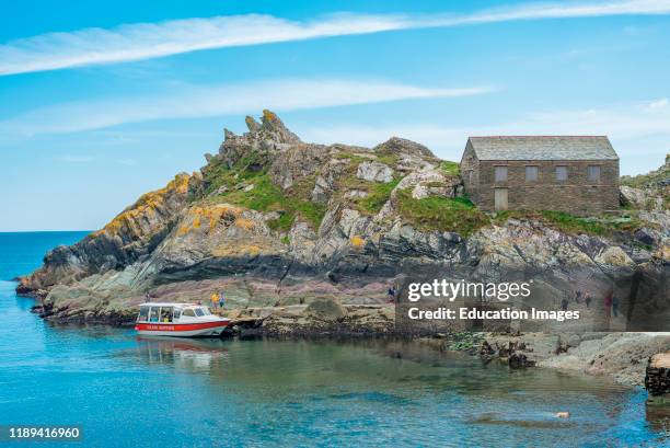The net loft on Chapel Rock at the entrance to Polperro harbor in Cornwall, England, UK.