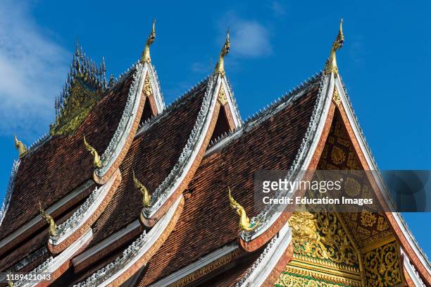 Multi-tiered roof with stylized Naga finials at its end, Haw Pha Bang also known as Wat Ho Pha Bang, a recently built temple in traditional Lao style...