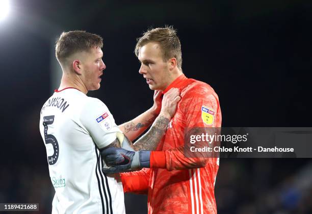 Alfie Mawson of Fulham FC and Marek Rodak of Fulham FC interact during the Sky Bet Championship match between Fulham and Queens Park Rangers at...