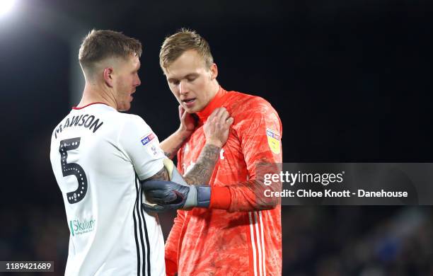 Alfie Mawson of Fulham FC and Marek Rodak of Fulham FC interact during the Sky Bet Championship match between Fulham and Queens Park Rangers at...