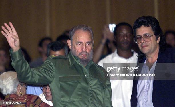 Cuban President Fidel Castro and Culture Minister Abel Prieto greet Cubans during a program 16 October 2002 in Havana. Musicians performed pieces...