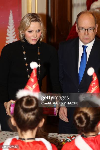 Prince Albert II of Monaco and his wife Charlene of Monaco attend the children's christmas event at the Monaco Palace on December 18, 2019.