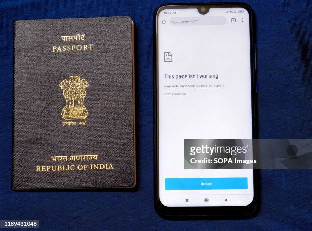 In this photo illustration, 'This page isn't working' notification seen displayed on a smartphone beside an Indian Passport. West Bengal Government...