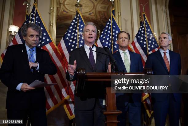 Senators Sherrod Brown, , Chris Van Hollen , Pat Toomey, , and Rob Portman , attend a press conference after the passing of the 2020 National Defense...