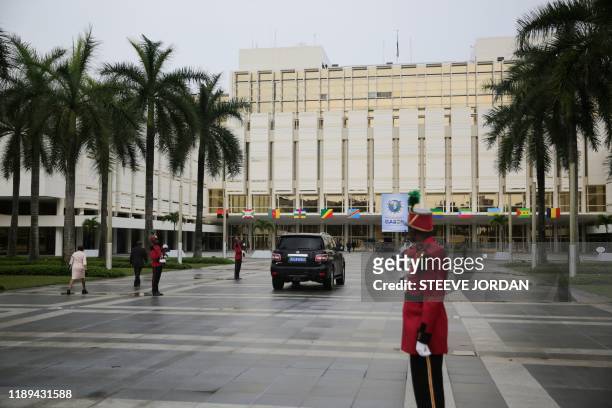 Guards stand in front of the presidential palace where the summit of the Economic Community of Central African States takes place in Libreville, on...