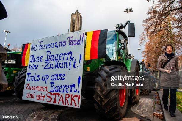 Tractor is decorated with a placard and German flags, during one of the farmer protests that took place in Arnhem, on December 18th 2019.