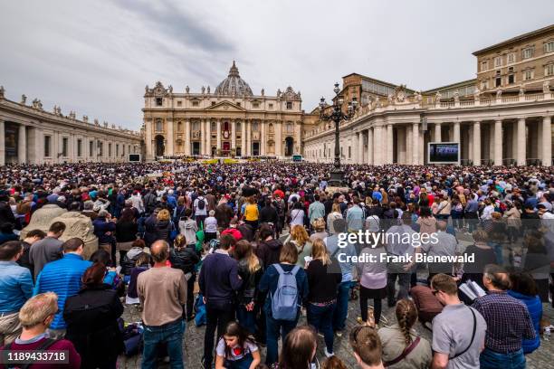 View over St. Peter's Square with thousands of people joining the Easter sermon of the Pope, the Papal Basilica of St. Peter, St. Peter's Basilica in...