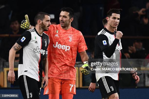 Juventus' Italian defender Leonardo Bonucci, Juventus' Italian goalkeeper Gianluigi Buffon and Juventus' Portuguese forward Cristiano Ronaldo react...