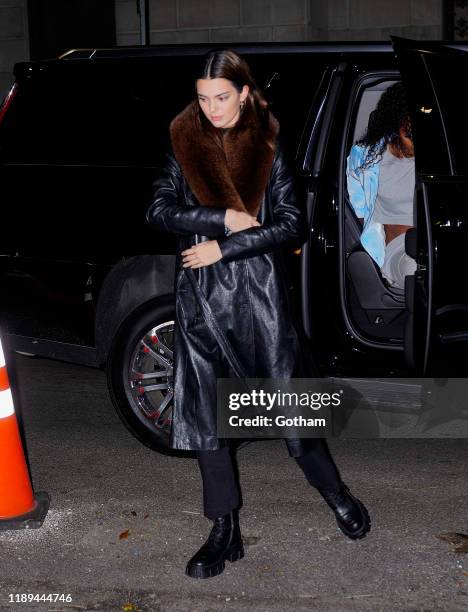 KEndall Jenner wears a long leather trench on November 22, 2019 in New York City.