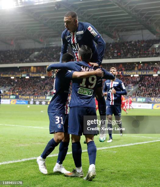 Pablo Sarabia of Paris Saint-Germain celebrates his goal with Kylian Mbappe and teammates during the Ligue Cup match between Le Mans FC and Paris...