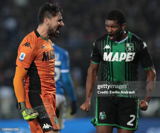 Gianluca Pegolo of US Sassuolo celebrates with his team-mate Marlon after making a save during the Serie A match between Brescia Calcio and US...