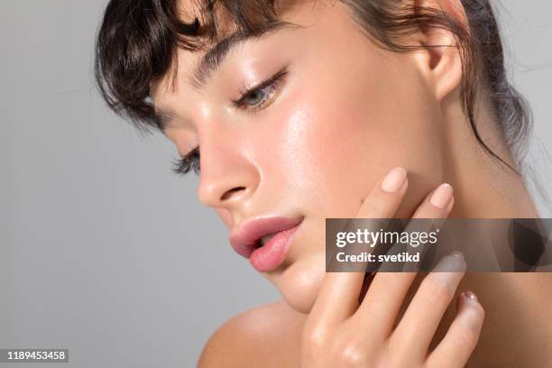 woman beauty portrait - finger bun stock pictures, royalty-free photos & images