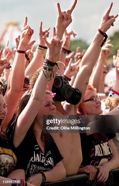 Music festival fans watching the Sum 41 performs onstage at Sonisphere Festival at Knebworth House on July 9, 2011 in Stevenage, England.