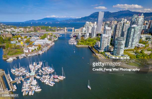 aerial view of granville island & downtown vancouver, british columbia, canada - vancouver foto e immagini stock