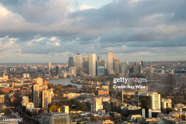sunset over east london from an aerial view. - tower hamlets foto e immagini stock