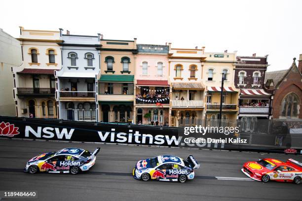 Shane van Gisbergen drives the Red Bull Holden Racing Team Holden Commodore ZB leads Jamie Whincup drives the Red Bull Holden Racing Team Holden...