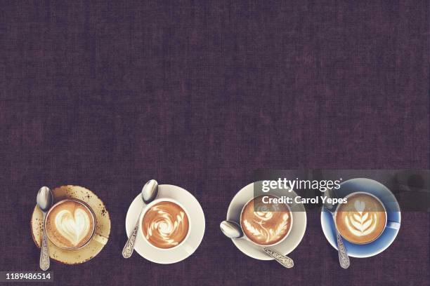 top view of latte art coffee mugs on timber background. - chocolate top view stockfoto's en -beelden