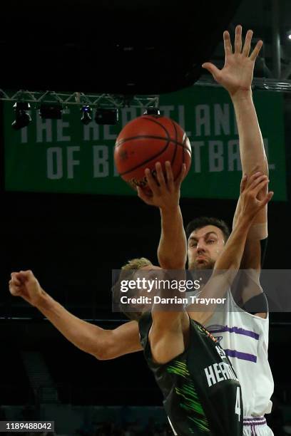 Andrew Bogut of the Kings rejects the shot of Kyle Adnam of the Phoenix during the round 8 NBL match between the South East Melbourne Phoenix and the...