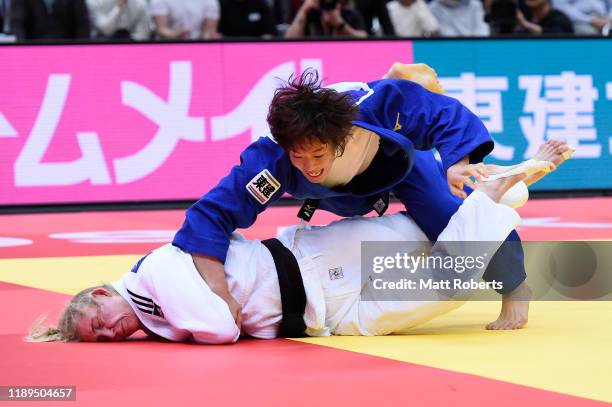 Kim Polling of Netherlands and Yoko Ono of Japan compete in the Women's -70kg Final on day two of the Judo Grand Slam at the Maruzen Intec Arena...